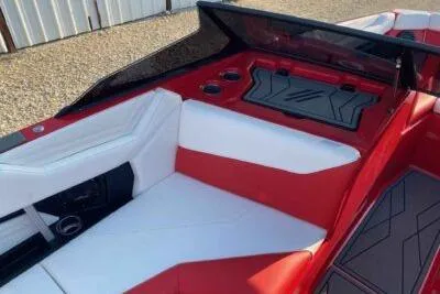 Slide: The Image of 2026 ATX Surf Boats 22 Type-S interior with red and white seating, cup holders, and sleek design. - 8