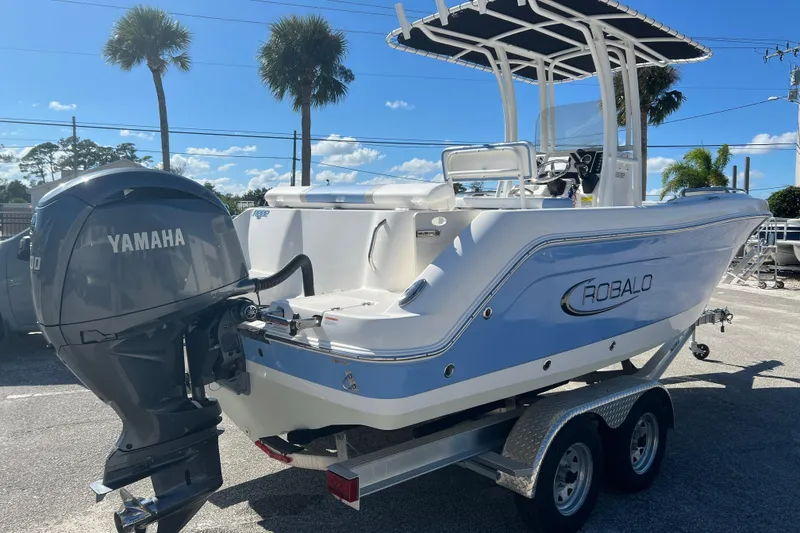 Slide: The Image of 2024 Robalo R222 Center Console boat with Yamaha engine on trailer. - 3