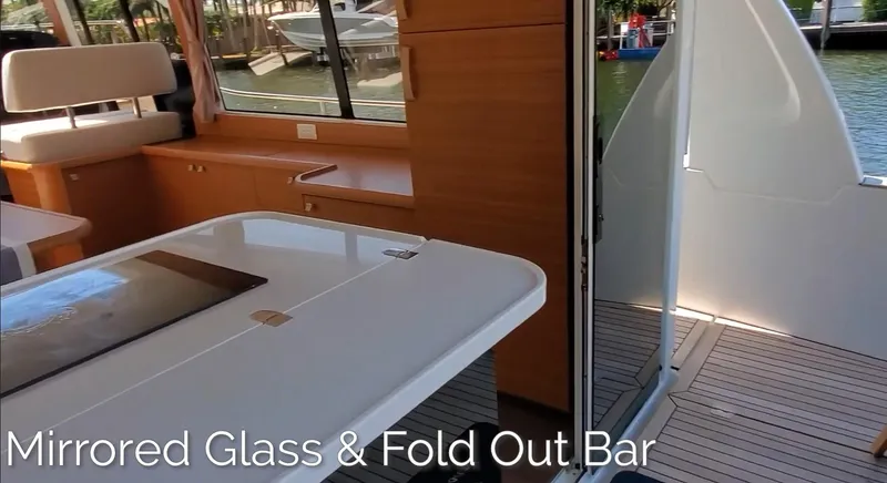 Slide: The Image of Interior of 2023 Greenline 40 yacht with mirrored glass and fold-out bar. - 20