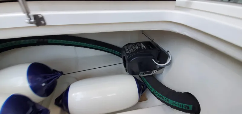 Slide: The Image of Storage compartment in a 2023 Greenline 40 boat with fenders and equipment. - 22