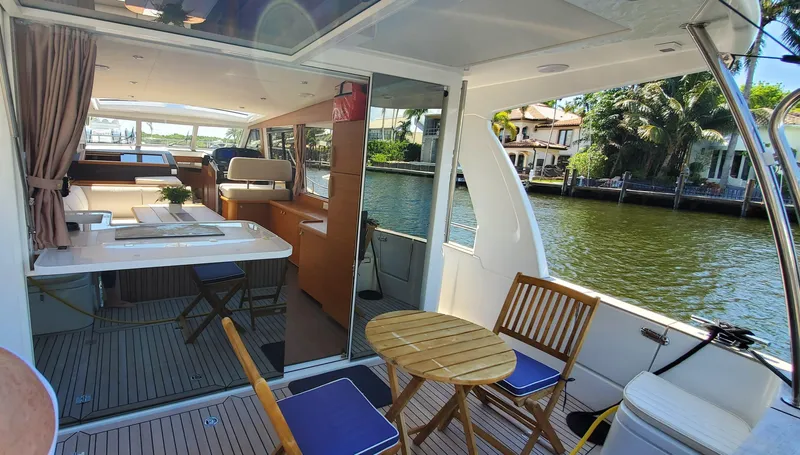 Slide: The Image of Luxurious 2023 Greenline 40 yacht interior with elegant seating and scenic waterway view. - 31