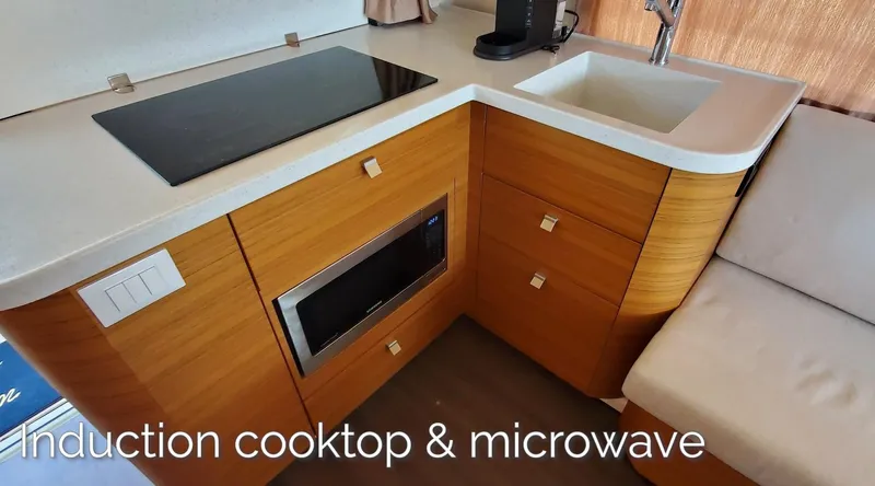 Slide: The Image of Modern kitchen in 2023 Greenline 40 yacht with induction cooktop and microwave. - 34
