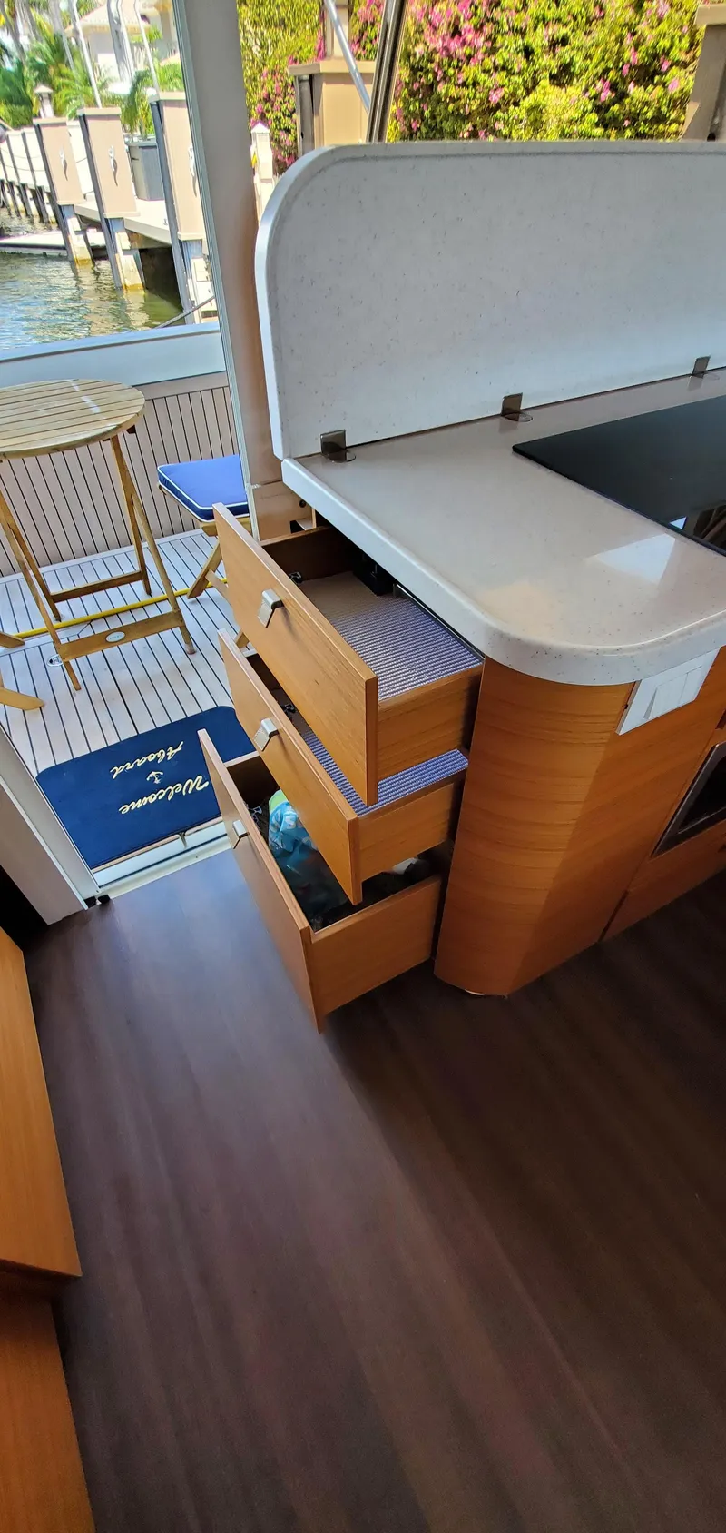 Slide: The Image of Modern kitchen area on a 2023 Greenline 40 yacht with open drawers and sleek design. - 40