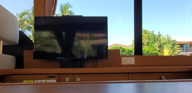 Slide: The Image of Interior of 2023 Greenline 40 yacht with TV and scenic window view. - 44