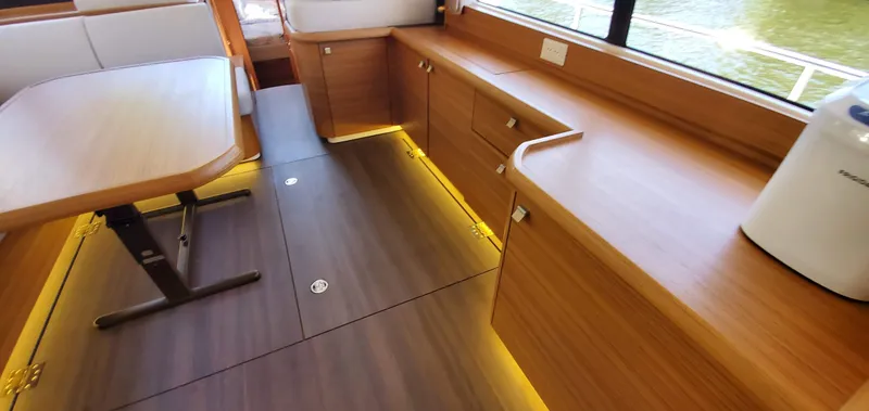 Slide: The Image of Modern interior of 2023 Greenline 40 yacht with wood finish and ambient lighting. - 45