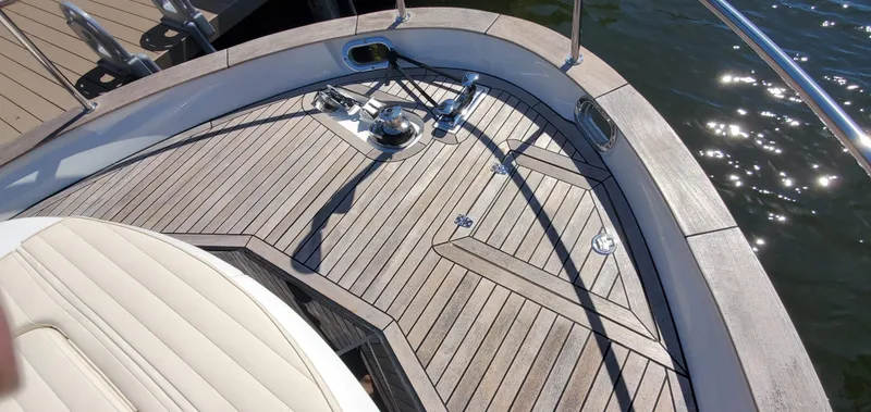Slide: The Image of Deck of 2023 Greenline 40 yacht with sleek wood finish and stainless steel fittings. - 7