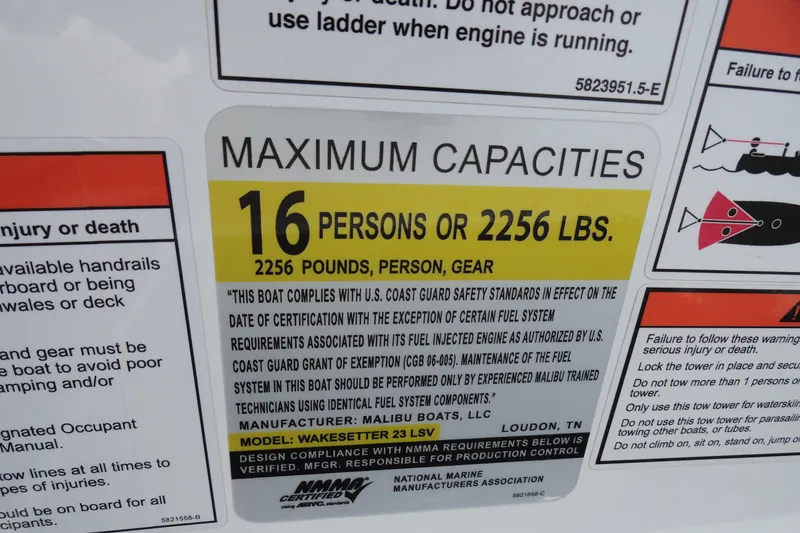 Slide: The Image of 2021 Malibu Wakesetter 23 LSV capacity label: 16 persons or 2256 lbs, safety compliance. - 15