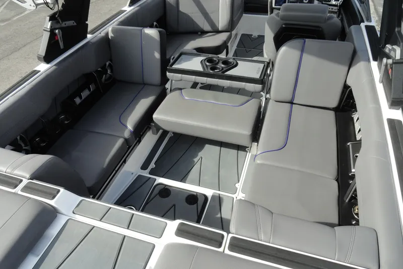 Slide: The Image of 2021 Malibu Wakesetter 23 LSV interior with gray seating and cup holders. - 23