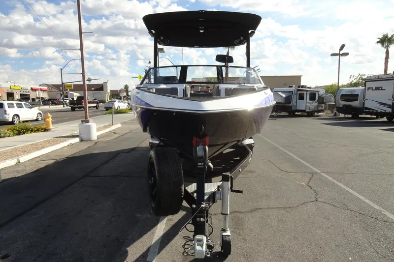 Slide: The Image of 2021 Malibu Wakesetter 23 LSV boat on trailer in parking lot. - 3