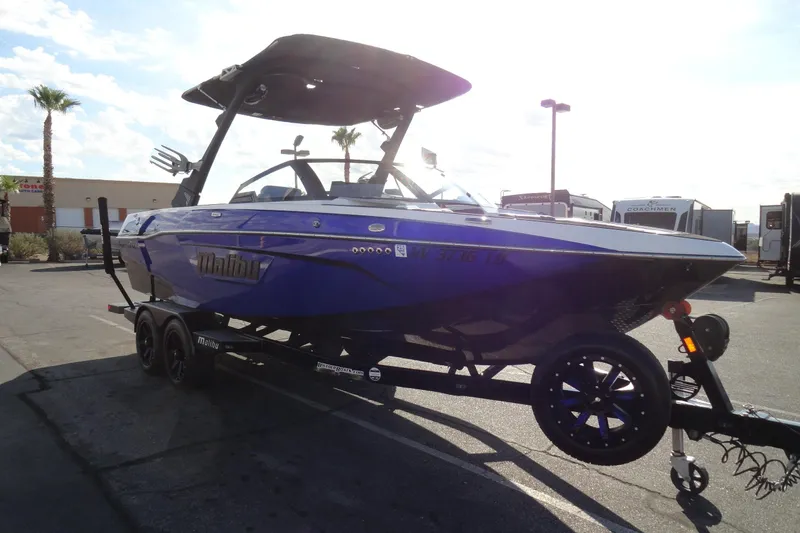 Slide: The Image of 2021 Malibu Wakesetter 23 LSV boat on trailer in sunny parking lot. - 4