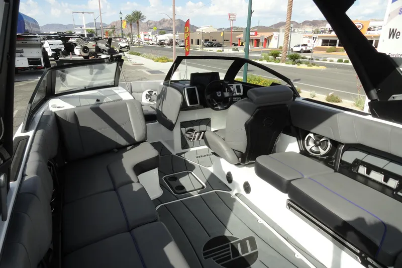 Slide: The Image of 2021 Malibu Wakesetter 23 LSV interior with sleek seating and modern dashboard. - 9
