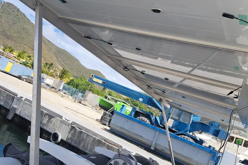 Slide: The Image of Luxurious 2017 Lagoon 52 F yacht interior with spacious seating and elegant wooden table. - 17