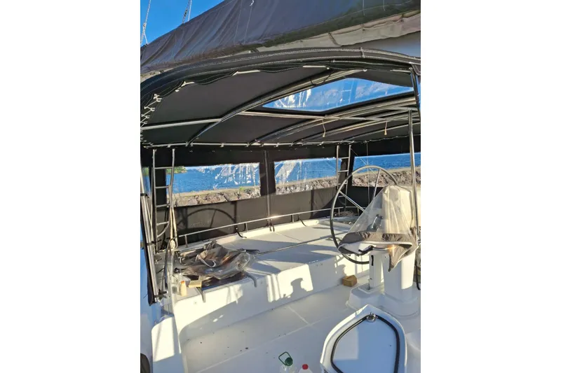 Slide: The Image of Luxurious 2017 Lagoon 52 F yacht interior with elegant seating and scenic marina view. - 18