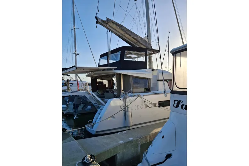 Slide: The Image of Luxurious interior of 2017 Lagoon 52 F catamaran with modern navigation station and seating area. - 22