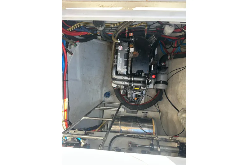 Slide: The Image of Engine compartment of 2017 Lagoon 52 F catamaran, showcasing mechanical components and wiring. - 51