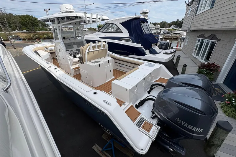 Slide: The Image of 2018 Tidewater 280 CC Adventure boat with spacious deck and modern seating. - 10