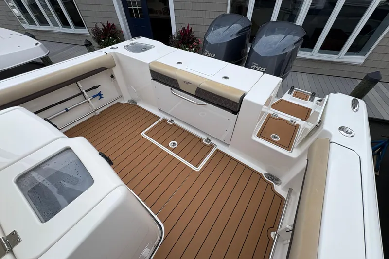 Slide: The Image of 2018 Tidewater 280 CC Adventure boat with spacious deck and modern amenities. - 16