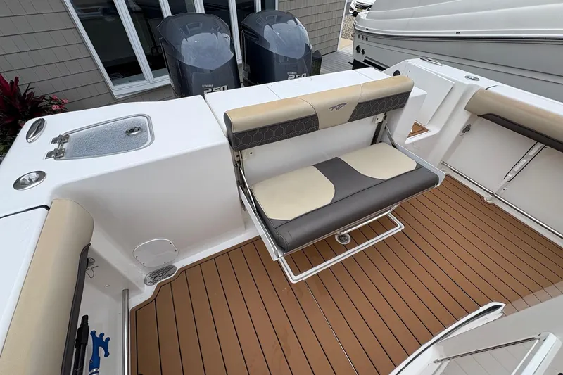 Slide: The Image of 2018 Tidewater 280 CC Adventure boat with dual engines and spacious deck layout. - 17