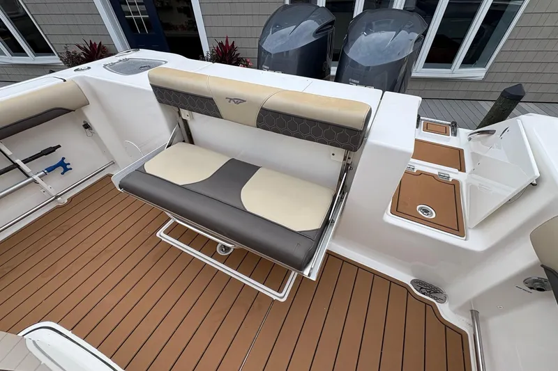 Slide: The Image of 2018 Tidewater 280 CC Adventure boat interior with seating and deck view. - 18