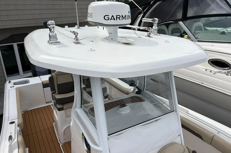 Slide: The Image of 2018 Tidewater 280 CC Adventure boat with spacious seating and modern design. - 24