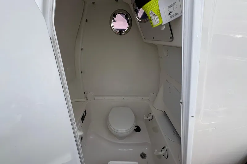 Slide: The Image of 2018 Tidewater 280 CC Adventure boat with Garmin radar, featuring sleek design and comfortable seating. - 25