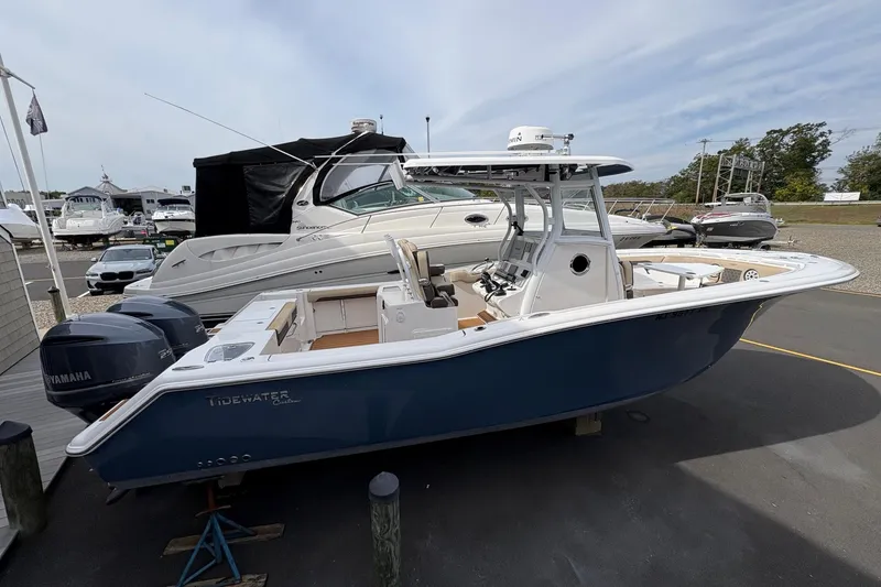 Slide: The Image of 2018 Tidewater 280 CC Adventure boat displayed at marina dealership. - 8