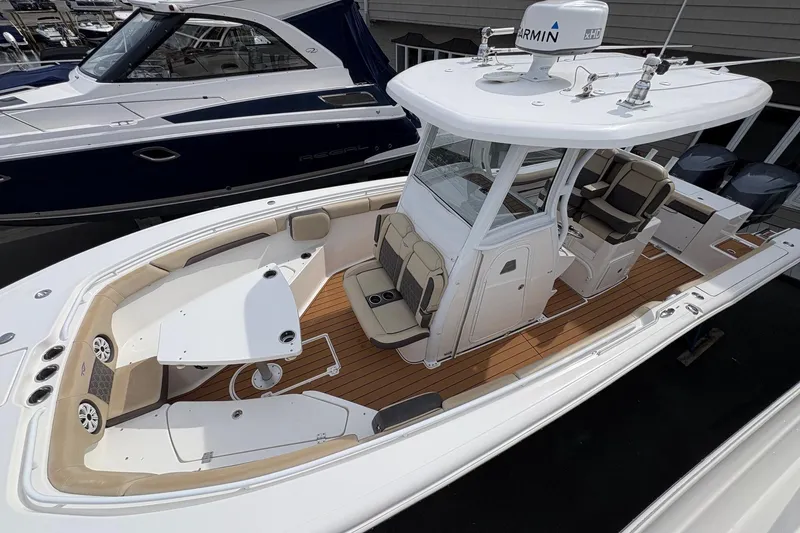 Slide: The Image of 2018 Tidewater 280 CC Adventure boat with spacious deck and modern design. - 9