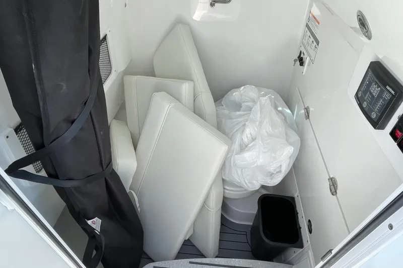 Slide: The Image of Interior of 2026 Everglades 285 Center Console boat with storage and equipment. - 10