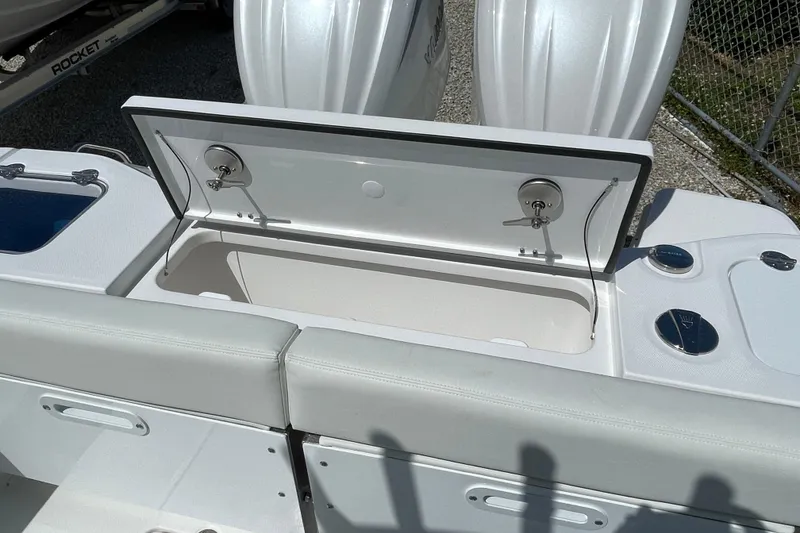 Slide: The Image of 2026 Everglades 285 Center Console boat with open storage compartment. - 18