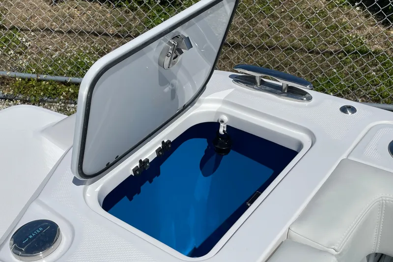 Slide: The Image of Open storage compartment on 2026 Everglades 285 Center Console boat, featuring sleek design. - 20