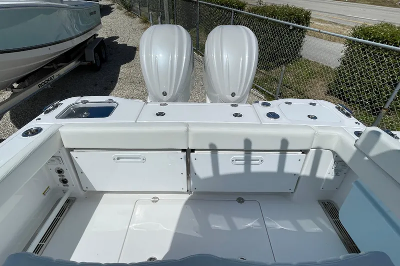 Slide: The Image of 2026 Everglades 285 Center Console boat with dual engines, white interior, and spacious deck. - 22