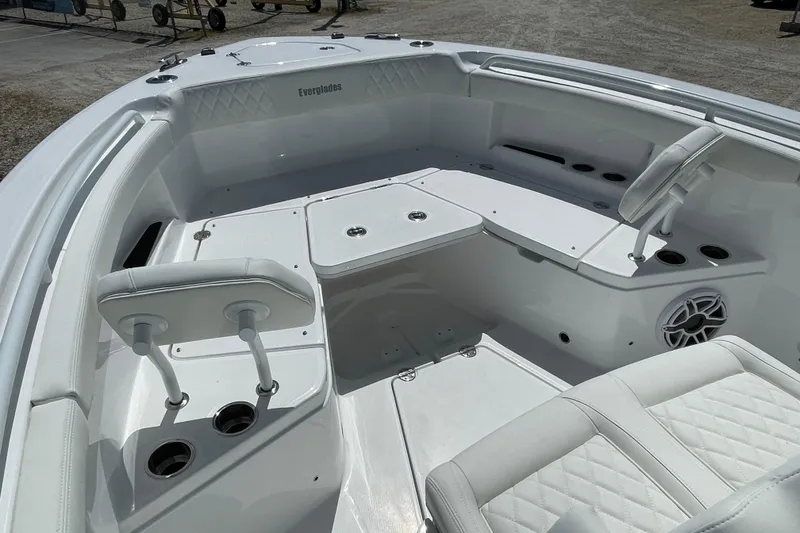 Slide: The Image of 2026 Everglades 285 Center Console boat interior with seating and cup holders. - 3