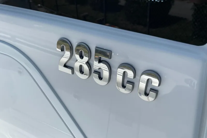 Slide: The Image of 2026 Everglades 285 Center Console boat emblem on white surface. - 8