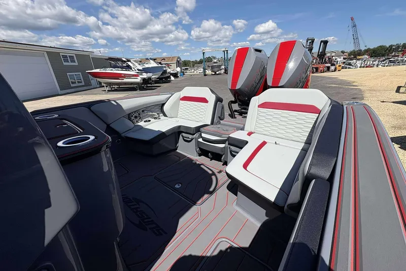 Slide: The Image of 2026 Sunsation 32 CCX boat interior with modern seating and dual outboard motors. - 10