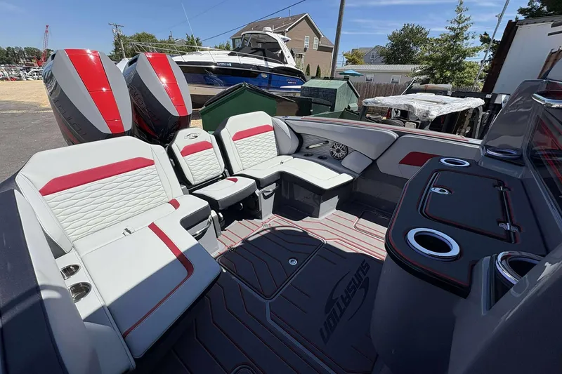 Slide: The Image of 2026 Sunsation 32 CCX boat interior with red and white seating, dual engines, and modern amenities. - 13