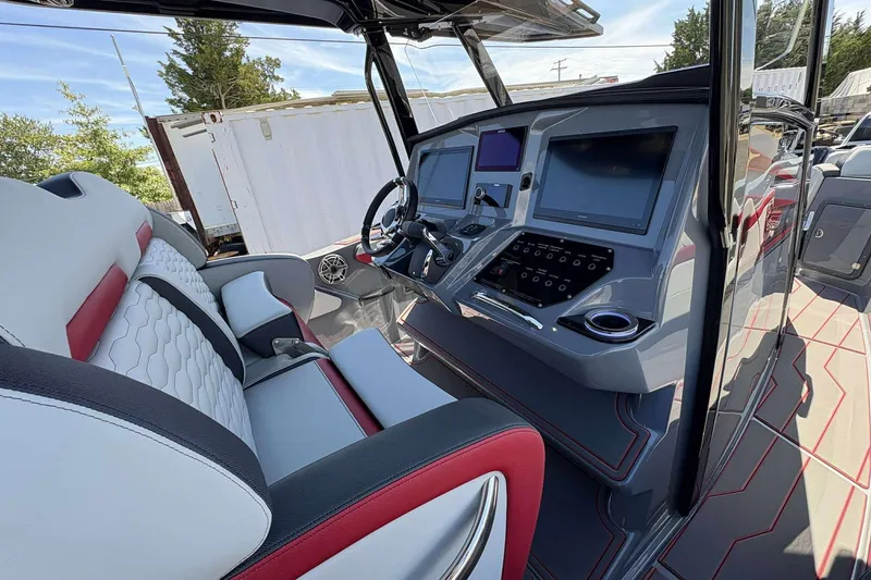 Slide: The Image of 2026 Sunsation 32 CCX boat interior with modern dashboard and luxurious seating. - 14