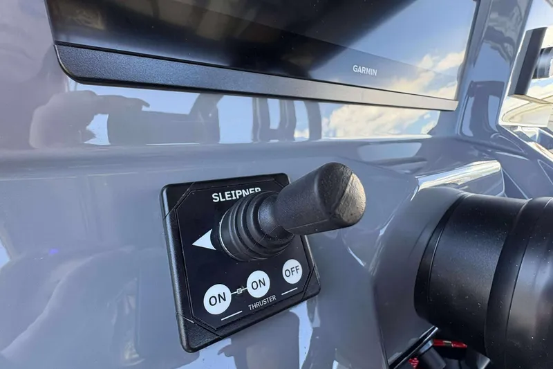 Slide: The Image of Control panel of 2026 Sunsation 32 CCX boat with Garmin display and thruster joystick. - 29