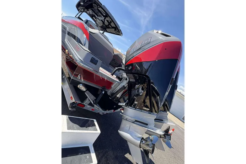 Slide: The Image of 2026 Sunsation 32 CCX boat with powerful outboard engines, sleek design, and vibrant colors. - 31