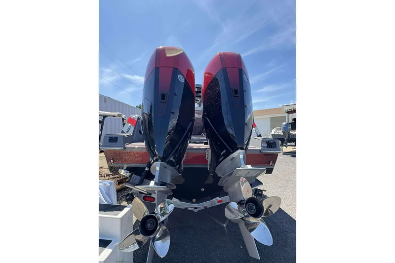 Slide: The Image of 2026 Sunsation 32 CCX boat with dual outboard engines, rear view under clear sky. - 34