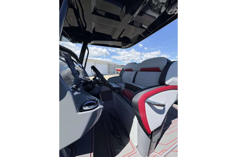 Slide: The Image of 2026 Sunsation 32 CCX boat interior with modern seating and sleek dashboard design. - 6