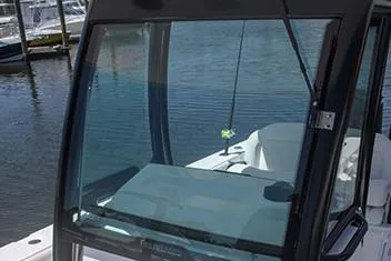 Slide: The Image of Manufacturer Provided Image: 2020 Everglades 273 Center Console boat windshield and console at marina. - 12