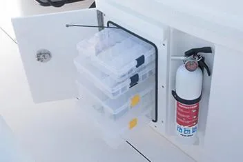 Slide: The Image of Manufacturer Provided Image: Storage compartment with tackle boxes and fire extinguisher on 2020 Everglades 273 Center Console boat. - 18