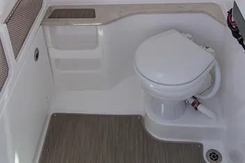 Slide: The Image of Manufacturer Provided Image: 2020 Everglades 273 Center Console boat interior with toilet and storage. - 20