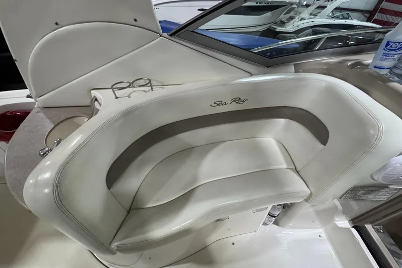 Slide: The Image of 2004 Sea Ray 320 Sundancer boat interior with white leather seating. - 29
