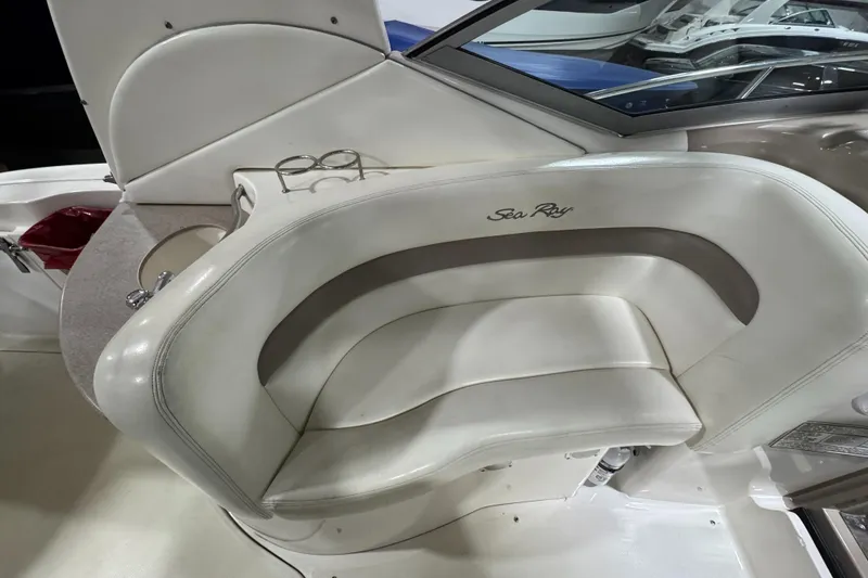 Slide: The Image of Luxury seating on a 2004 Sea Ray 320 Sundancer boat, featuring elegant white upholstery. - 30