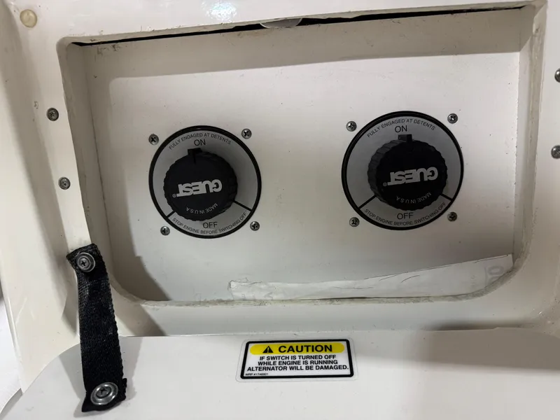 Slide: The Image of Control panel of a 2004 Sea Ray 320 Sundancer boat with caution label. - 31