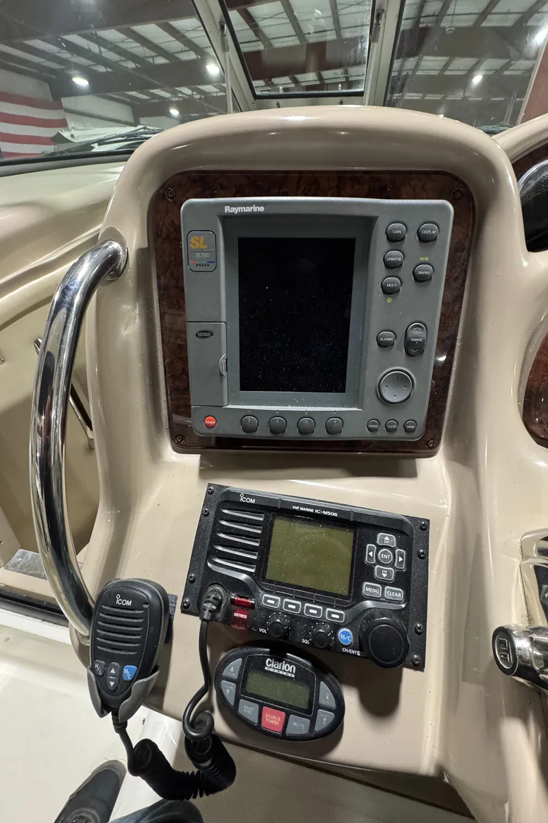 Slide: The Image of Control panel of a 2004 Sea Ray 320 Sundancer boat with navigation equipment. - 34