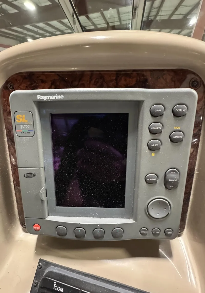 Slide: The Image of Raymarine navigation system on 2004 Sea Ray 320 Sundancer boat dashboard. - 35