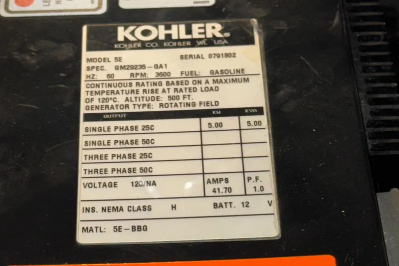 Slide: The Image of Kohler generator label on a 2004 Sea Ray 320 Sundancer, model 5E, gasoline-powered. - 52