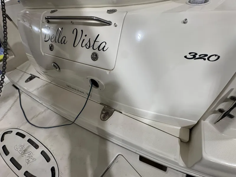 Slide: The Image of 2004 Sea Ray 320 Sundancer boat with "Bella Vista" nameplate on the stern. - 61
